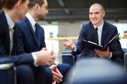 smiling executive with open folder